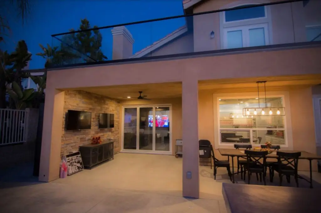 Home remodeling contractor building a custom deck and California room in Orange County, creating a covered outdoor living and entertainment space.