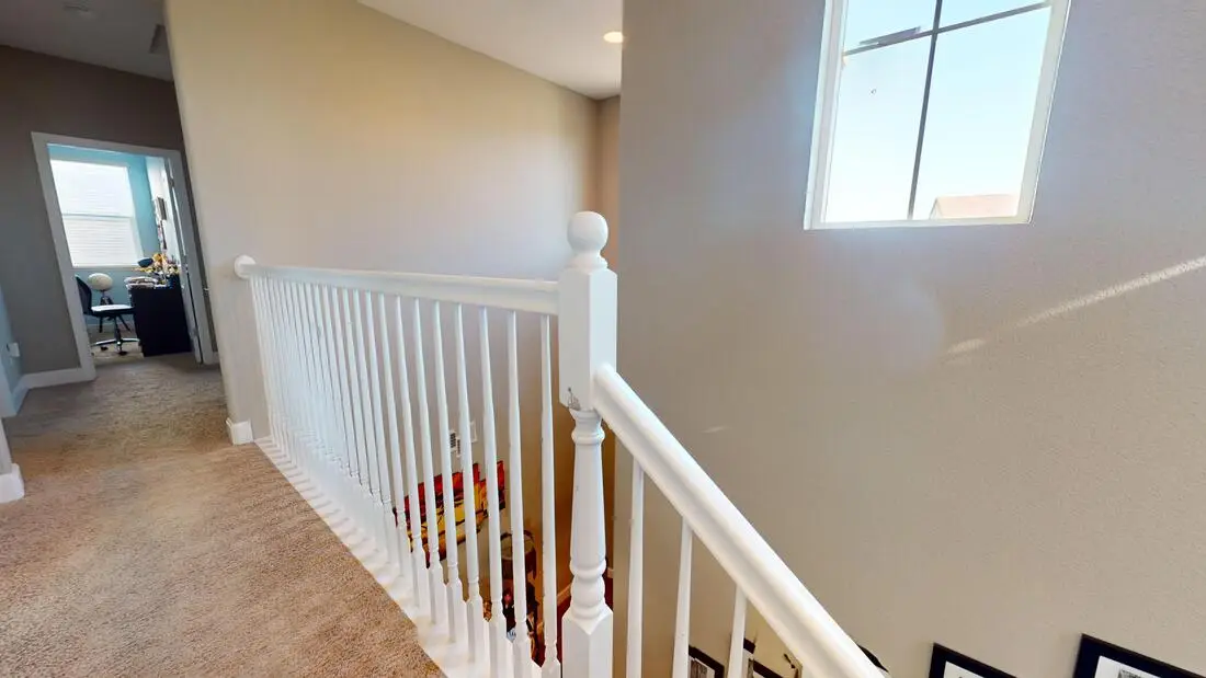 Upstairs hallway railing overlooking the open entry before the Rocklin loft conversion